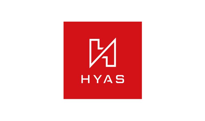 A logo consisting of a red square with a white abstract geometric shape resembling an intertwined h and y above the capitalized text "hyas".