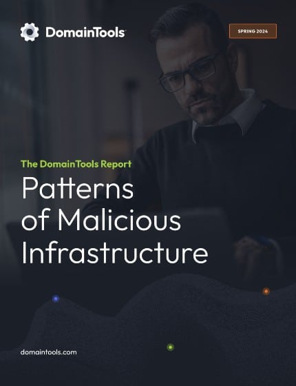 A professional man, wearing glasses, intently reads a digital tablet beside the cover of "the Economic Benefits of DomainTools Internet Intelligence" on patterns of malicious infrastructure, spring 2024 edition.