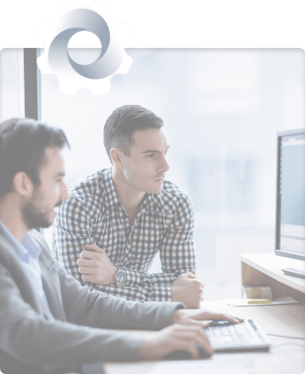 Domaintools Resell Partner Program Header Image Two men Sitting at Desktop