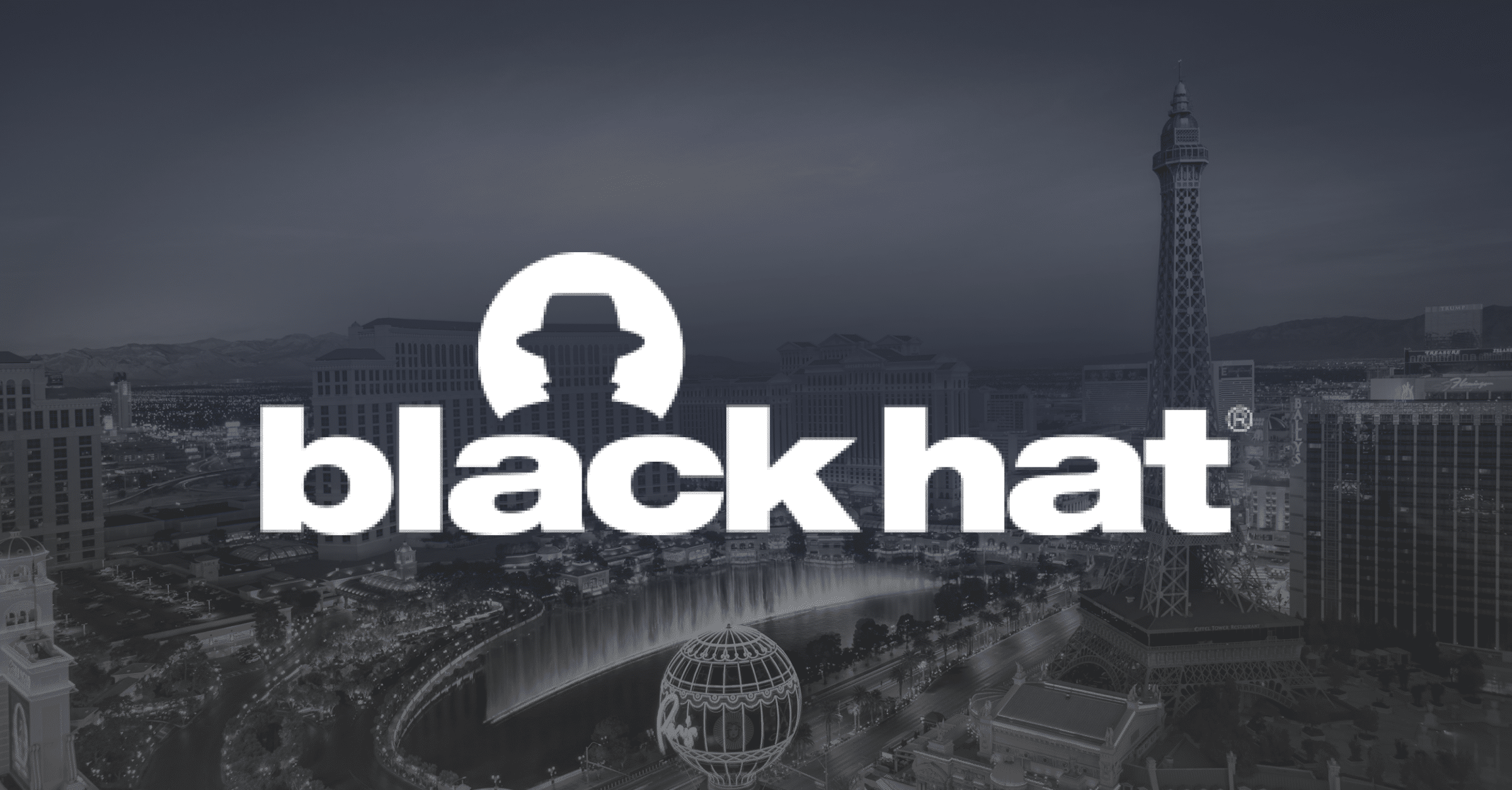 The Black Hat conference logo, featuring a silhouette of a person in a hat above the words “black hat,” is overlaid on a grayscale cityscape of Las Vegas, including the Eiffel Tower replica.