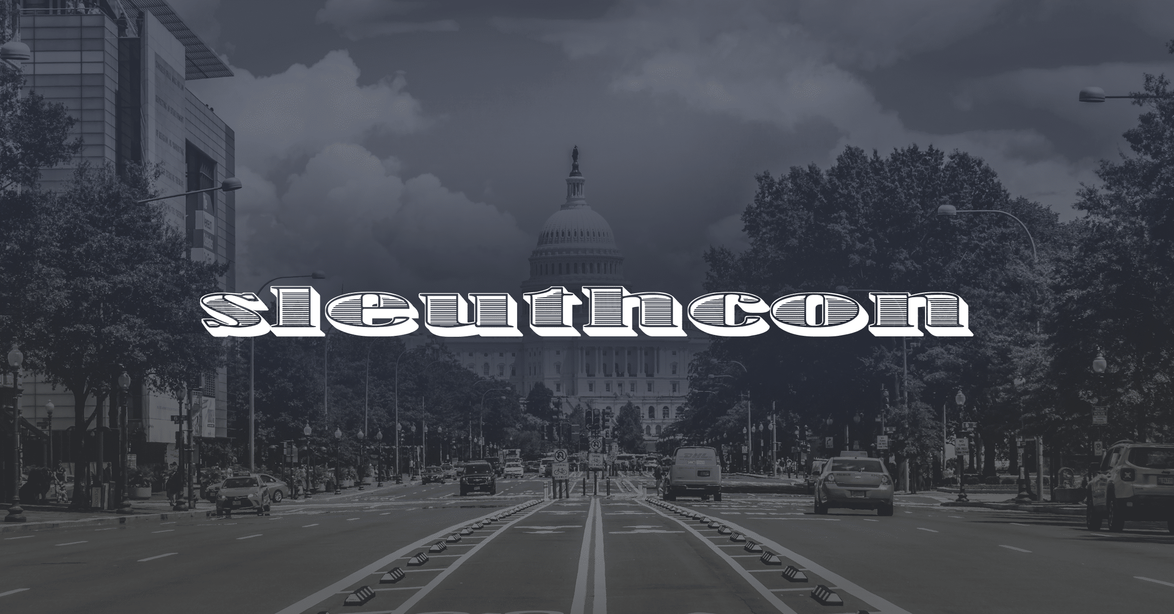A city street leads to a domed government building, likely the U.S. Capitol. Trees and vehicles line the road. The word "sleuthcon" is boldly centered in stylized white text.