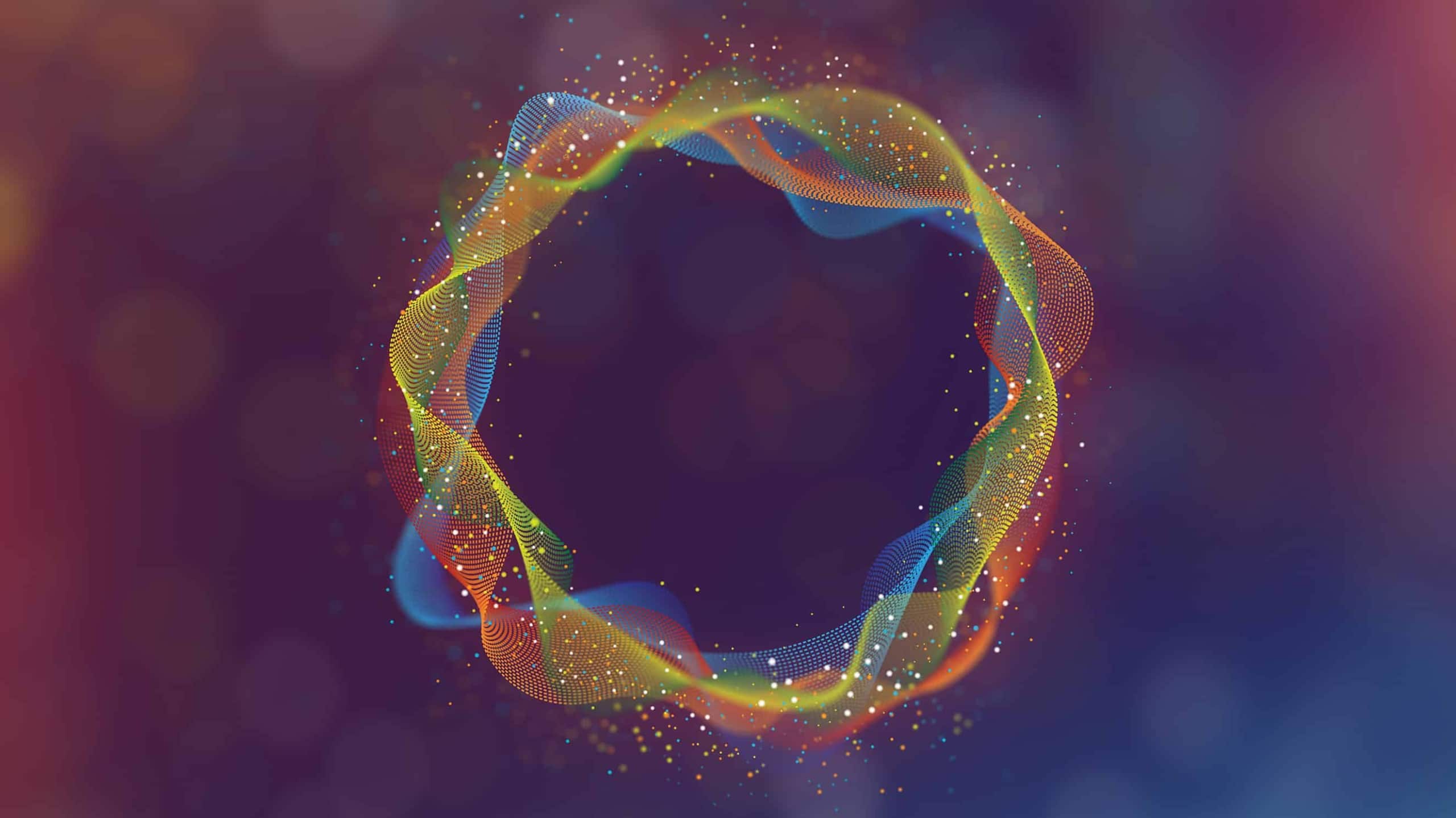 A glowing, circular abstract shape composed of vibrant, colorful dots connected by lines, forming a dynamic, swirling pattern against a blurred blue and red background.