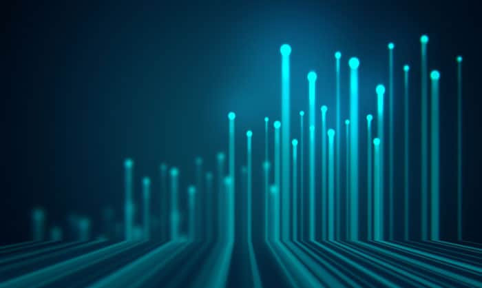 Abstract digital background featuring glowing blue vertical lines on a dark blue gradient, symbolizing data streaming or technology connectivity.