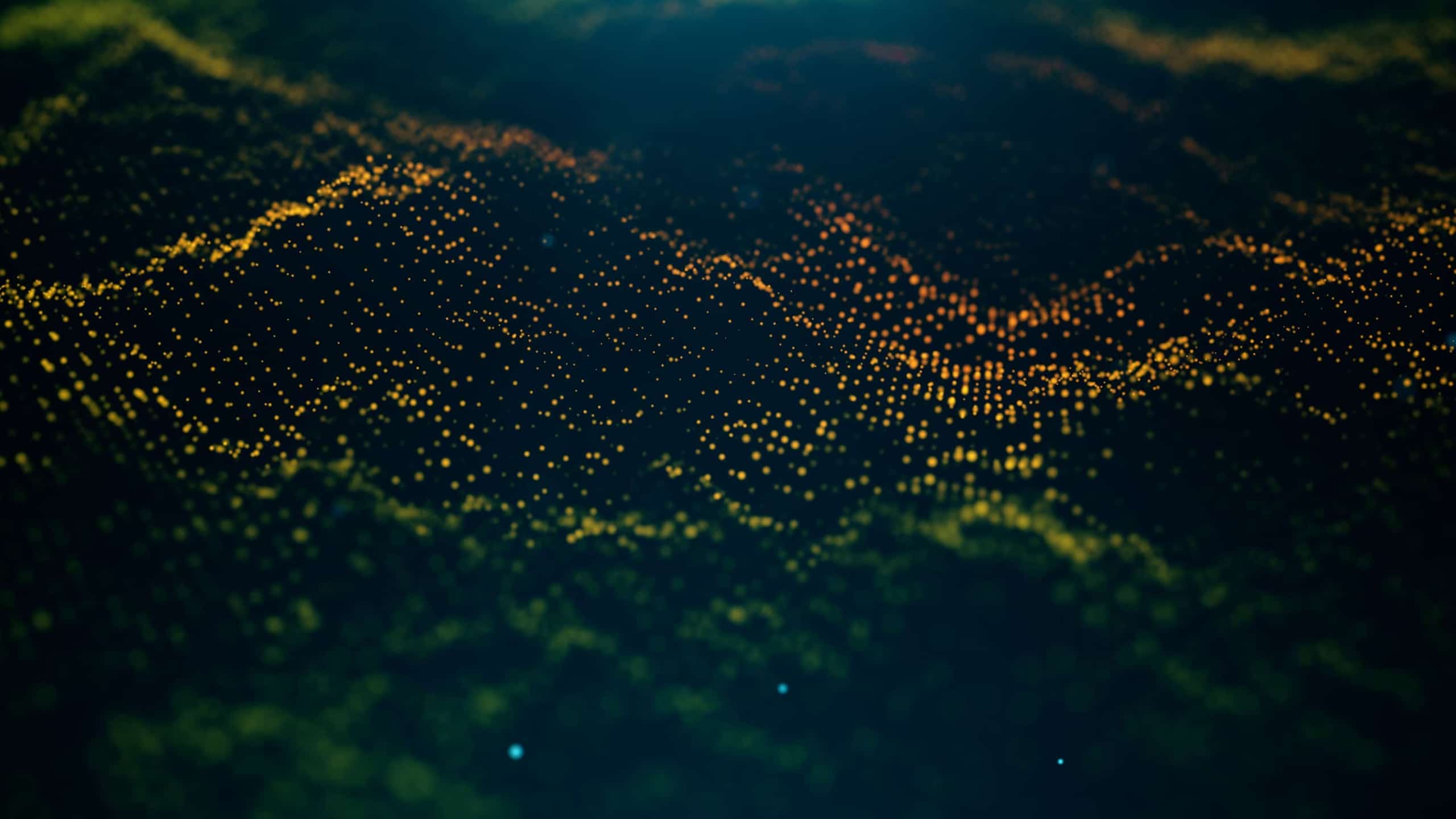 A digital representation of a landscape at night highlighted by numerous glowing yellow and orange dots, creating a wave-like pattern of illuminated terrain.