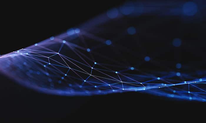 Abstract image of a dark background with blue illuminated connections in a network pattern, symbolizing advanced technology or digital connectivity.