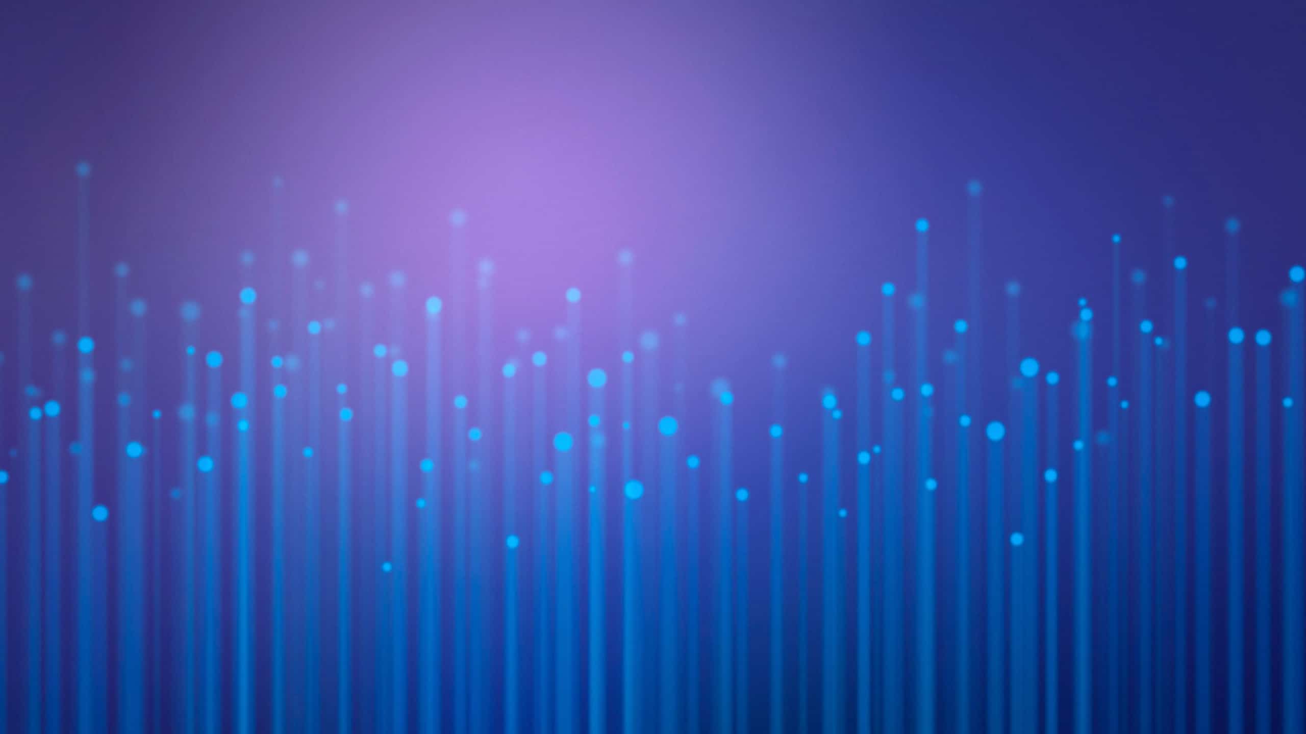 Abstract image of numerous blue light dots extending vertically against a soft purple background, creating a digital or futuristic ambiance, reminiscent of a DomainTools Recipe Book.