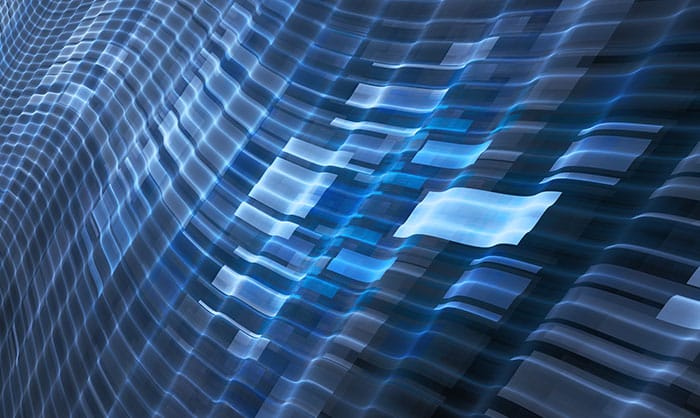 A digital art rendering of a small cluster of flowing, abstract blue wave patterns, suggesting movement and rhythm, across a dark background. The waves have a three-dimensional, textured look.