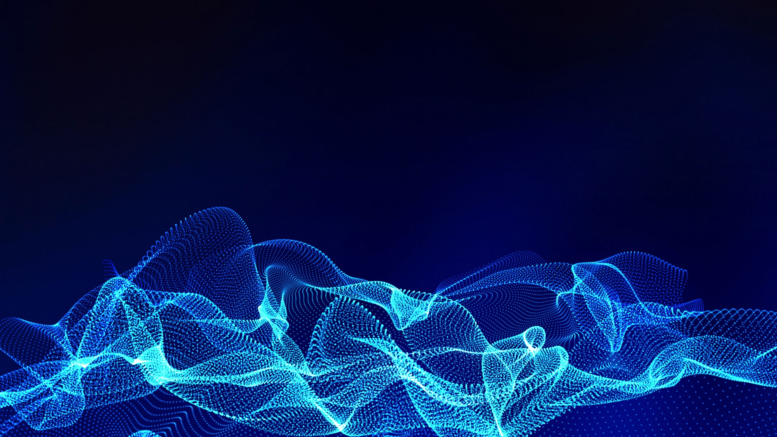 Abstract digital wallpaper featuring a dynamic, wavy pattern of blue glowing particles on a dark background, creating a visual effect that resembles a flowing, luminescent network.