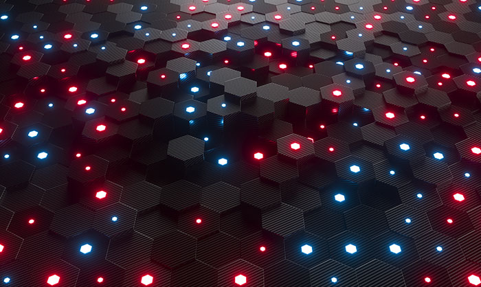 Close-up of a textured surface comprising hexagonal patterns with embedded blue and red led lights, creating a futuristic, illuminated pattern.