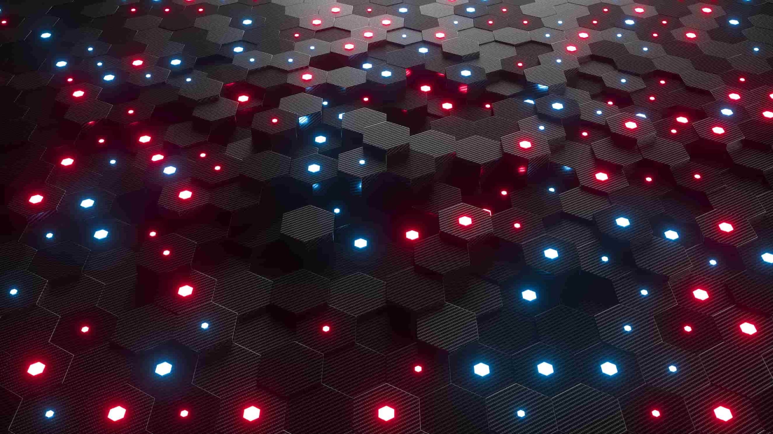 Abstract image of a hexagonal pattern surface illuminated by blue and red led lights, creating a futuristic and technological appearance.